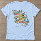 Light Blue Train Now Menace T-shirt — longevity training design, for women over 40