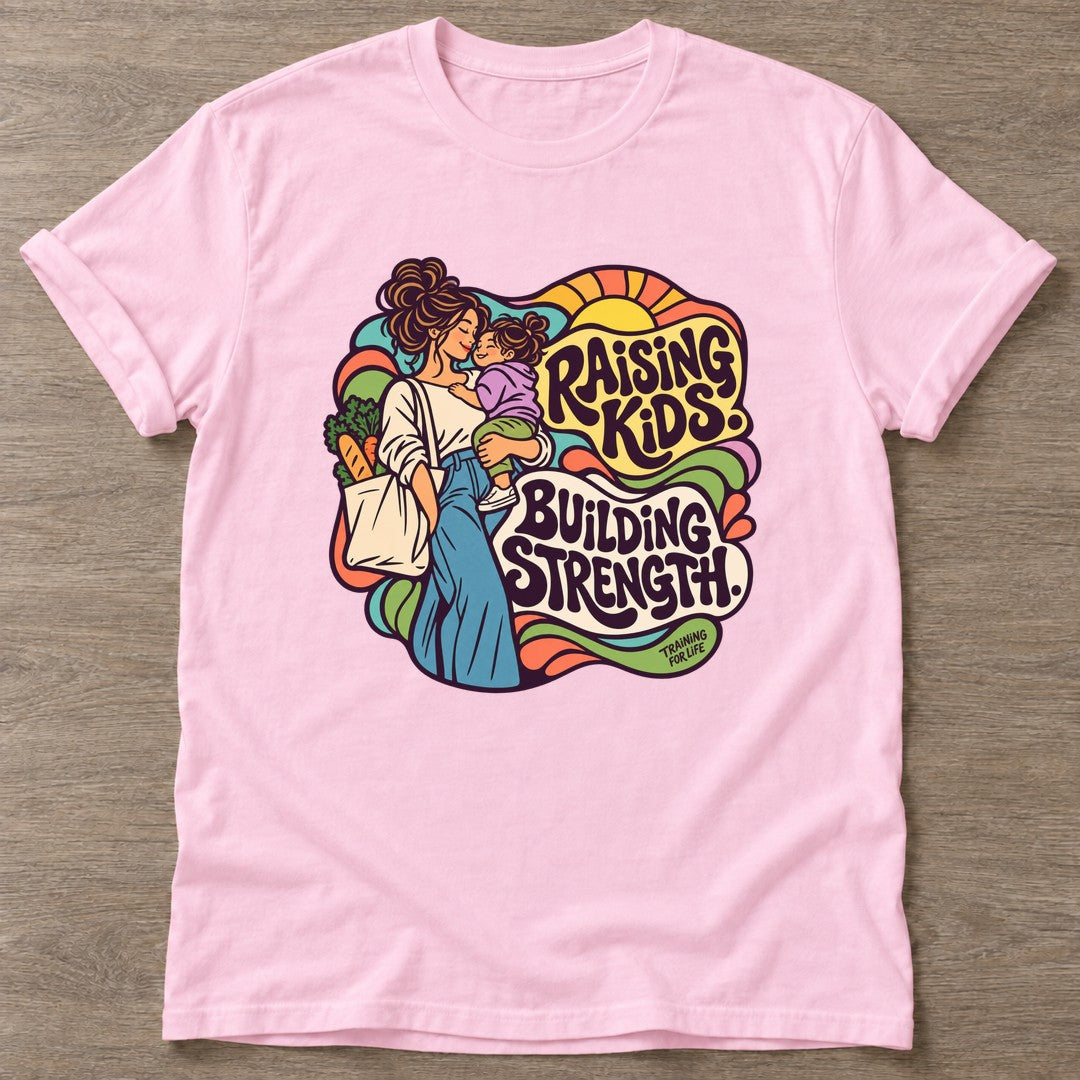 Light Pink Strength Through Motherhood T-shirt — motivational slogan design, for women who train