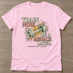 Light Pink Train Now Menace T-shirt — longevity training design, for women over 40