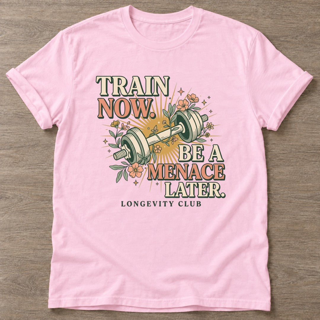 Light Pink Train Now Menace T-shirt — longevity training design, for women over 40