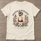 Natural Bloom Unshaken T-shirt — floral strength design, for women who train